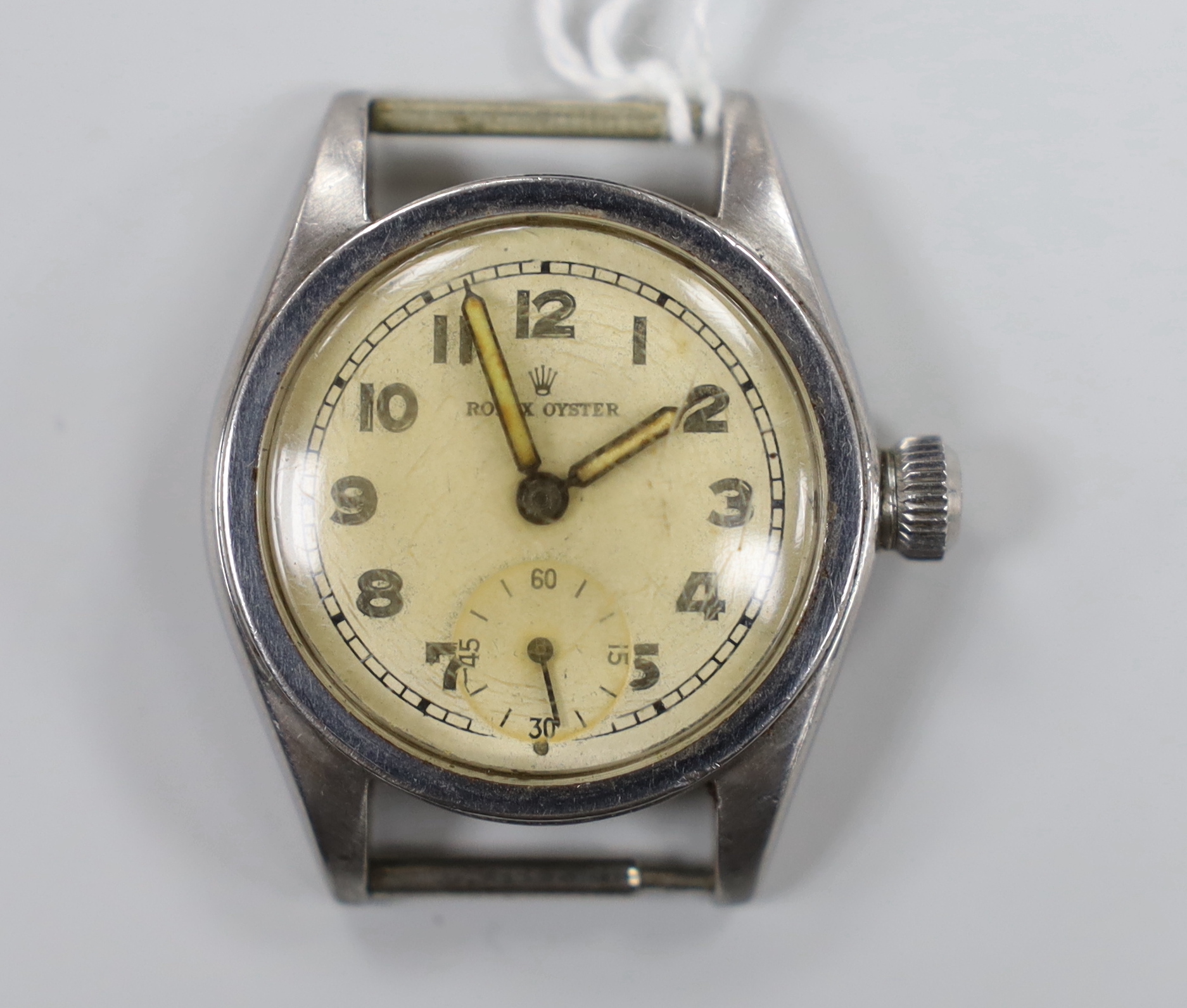 A 1940's boy's size stainless steel Rolex Oyster manual wind wrist watch, no strap, case diameter 30mm, with case back inscription.